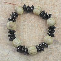 Wood beaded stretch bracelet, 'Charming Mother' - Brown and Black Sese Wood Beaded Stretch Bracelet from Ghana