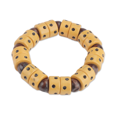 Wood and recycled plastic beaded stretch bracelet, 'Apple of Meniwa' - Dot Motif Wood and Plastic Stretch Bracelet from Ghana