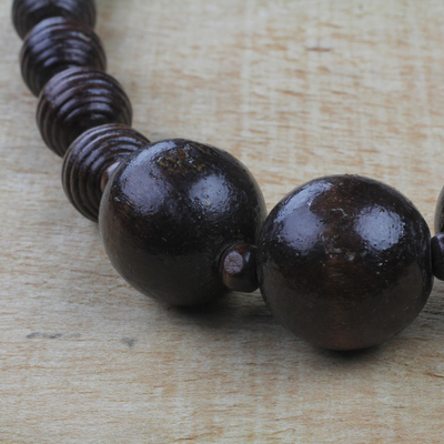 Wood beaded pendant necklace, 'Great Tribe' - Dark Sese Wood Beaded Pendant Necklace from Ghana
