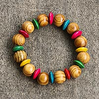 Wood beaded stretch bracelet, 'Eye of the Parrot' - Multicolored Sese Wood Beaded Stretch Bracelet from Ghana