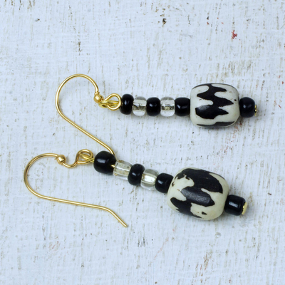 Batik wood and bone dangle earrings, 'All Is Well' - Black and White Recycled Sese Wood and Bone Dangle Earrings