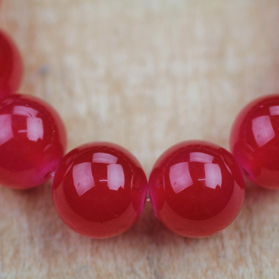 Recycled glass beaded stretch bracelet, 'Rosy Red' - Rosy Red Recycled Glass Beaded Bracelet from Ghana