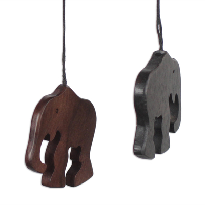 Ebony wood ornaments, 'Trunk Bearers' (set of 4) - Handcrafted Ebony Wood Elephant Ornaments (Set of 4)