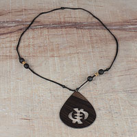 Wood pendant necklace, 'Gye Nyame Drop' - Sese Wood Gye Nyame Pendant Necklace from Ghana