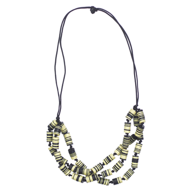 Recycled plastic beaded necklace, 'Live with Praise' - Recycled Plastic Disc Black and Yellow Statement Necklace