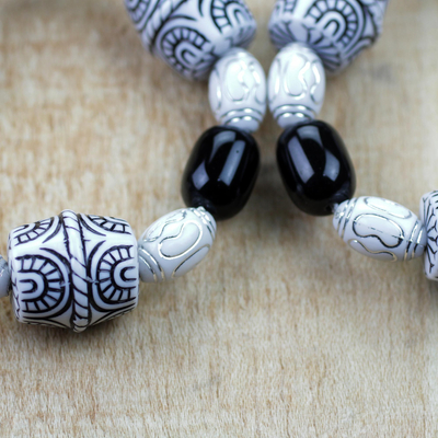 Recycled glass and plastic beaded stretch bracelets, 'Alewa' (pair) - Black and White Recycled Beaded Stretch Bracelets (Pair)