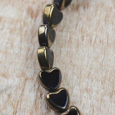 Recycled glass stretch bracelets, 'Medo Wiase' - Recycled Glass Beaded Hearts Pair of Stretch Bracelets
