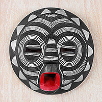 Featured review for African wood mask, Red Lips