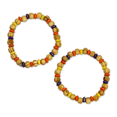Wood beaded stretch bracelet, 'Colors of Romance' - Colorful Sese Wood Beaded Stretch Bracelet from Ghana