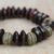 Wood and recycled plastic beaded stretch bracelet, 'Remembering Passion' - Brown Wood and Recycled Plastic Bracelet from Ghana (image 2c) thumbail