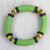 Recycled glass and plastic beaded stretch bracelet, 'Green Empress' - Handcrafted Recycled Glass and Plastic Beaded Bracelet
