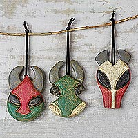 Wood ornaments, 'Ancestral Horns' (set of 3) - Wood Horned Mask Ornaments from Ghana (Set of 3)