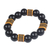 Stretch-Armband aus recycelten Kunststoffperlen, „Madanfo“ – Kräftiges Stretch-Armband aus recycelten Kunststoffperlen in Schwarz und Gelb