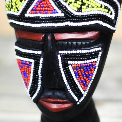 Recycled plastic beaded African wood mask, 'Sly Face' - African Wood Mask with Recycled Plastic Beads from Ghana
