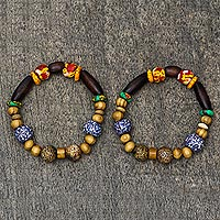 Wood and recycled glass beaded stretch bracelet, 'Revealing Beauty' - Wood and Recycled Glass Beaded Stretch Bracelet from Ghana