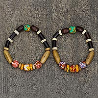 Beaded stretch bracelets, 'Emotional Beauty' (pair) - Wood and Recycled Glass Stretch Bracelets (Pair)