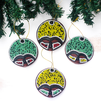 Recycled plastic beaded wood ornaments, 'Ashanti Faces' (set of 4) - Recycled Plastic Beaded Wood Ornaments from Ghana (Set of 4)