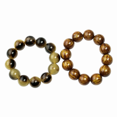 Recycled beaded stretch bracelets, 'Eco Partners' (pair) - Recycled Beaded Stretch Bracelets from Ghana (Pair)