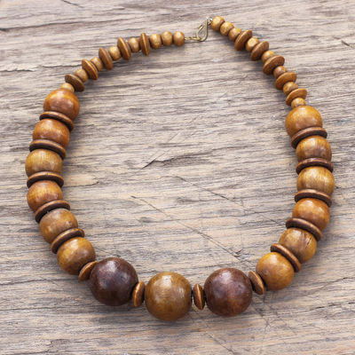 Wood beaded necklace, 'Promise of Beauty' - Sese Wood Necklace with Beads and Discs from Ghana