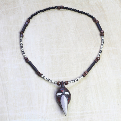 Wood and recycled glass beaded pendant necklace, 'Dan Bird' - Wood and Glass Beaded Bird Pendant Necklace from Ghana