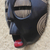 Máscara de madera africana, 'Ojos entrecerrados' - Máscara de madera africana redonda en negro de Ghana