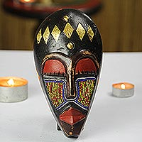 Recycled glass beaded African wood mask, 'Onyeisi'