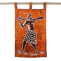 Cotton batik wall hanging, 'Horn Blower I' - Orange and Brown Music-Themed Batik Wall Hanging
