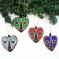 Wood and recycled glass bead ornaments, 'Eternal Love' (set of 4) - Heart-Shaped Sese Wood Holiday Ornaments (Set of 4)