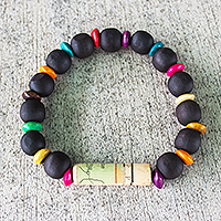 Wooden beaded stretch bracelet, 'Seize the Day' - Unisex Sese Wood Bracelet with Recycled World Map Bead