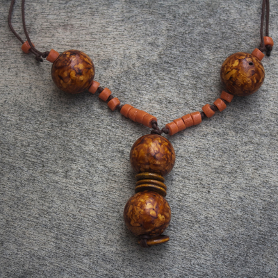 Wood and recycled glass bead necklace, 'Solace' - Sese Wood and Recycled Glass Bead Pendant Necklace