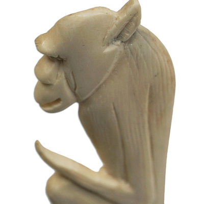 Bone statuette, 'Snacking' - Bone and Ebony Wood Monkey Statuette