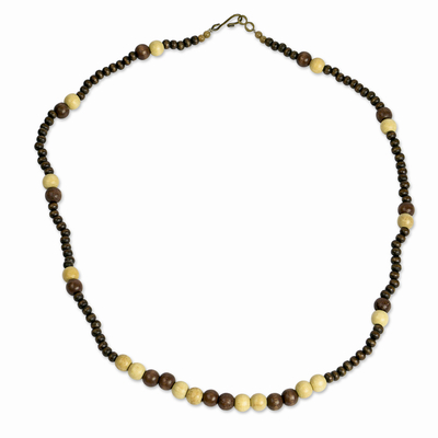 Beaded necklace, 'Faithful Heart' - Beaded Sese Wood Necklace from Ghana