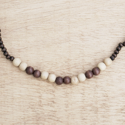 Beaded necklace, 'Faithful Heart' - Beaded Sese Wood Necklace from Ghana