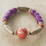 Eco-friendly beaded bracelet, 'Strong Heart' - Eco-Friendly Purple Beaded Bracelet from Ghana