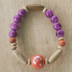 Eco-friendly beaded bracelet, 'Strong Heart' - Eco-Friendly Purple Beaded Bracelet from Ghana