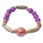 Eco-friendly beaded bracelet, 'Strong Heart' - Eco-Friendly Purple Beaded Bracelet from Ghana