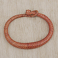 Braided leather bracelet, 'Orange Grace' - Handcrafted Braided Leather Bracelet in Orange