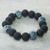 Eco-friendly beaded stretch bracelet, 'Blue-Black Beauty' - Recycled Glass Beaded Stretch Bracelet from Ghana