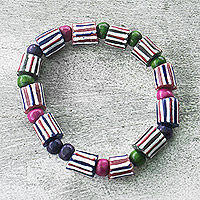 Recycled glass beaded stretch bracelet, 'Purple Attraction' - Eco-Friendly Beaded Stretch Bracelet with Purple Accents