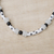 Glass beaded necklace, 'Black and White Grace' - Floral Recycled Glass Beaded Necklace in Black and White