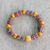 Recycled glass beaded stretch bracelet, 'Dzika' - Eco-Friendly Recycled Glass and Wood Beaded Stretch Bracelet