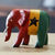 Figura de madera Sese - Figura de madera de elefante pintada con los colores de la bandera de Ghana