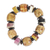 Recycled plastic and wood beaded stretch bracelet, 'Fortune Blooms' - Eco-Friendly Floral Sese Wood Beaded Bracelet from Ghana