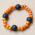 Recycled glass and wood beaded stretch bracelet, 'Orange Success' - Recycled Glass and Sese Wood Beaded Bracelet in Orange