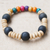 Recycled glass and wood beaded stretch bracelet, 'Divine Touch' - Vibrant Recycled Glass and Sese Wood Beaded Stretch Bracelet