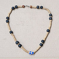 Recycled glass and wood beaded necklace, 'Blue Essence' - Sese Wood Beaded Necklace with Blue Recycled Glass Accent