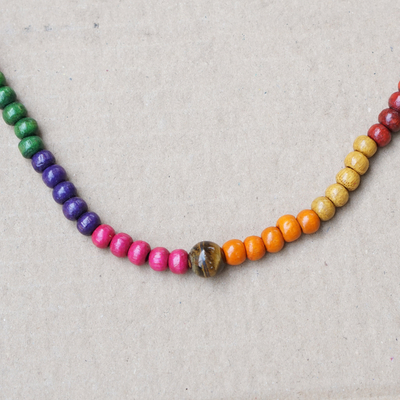 Tiger's eye and wood beaded necklace, 'Courage Festival' - Multicolor Sese Wood Beaded Necklace with Tiger's Eye Stone
