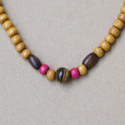Tiger's eye and wood beaded necklace, 'Fuchsia Confidence' - Fuchsia and Brown Sese Wood Beaded Necklace with Tiger's Eye