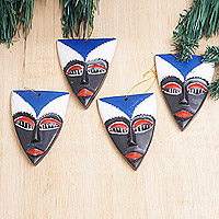 Wood ornaments, 'Sofo Spirit' (set of 4) - Set of 4 Hand-Painted Triangular Blue Sese Wood Ornaments