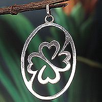 Sterling silver pendant, 'Unity Icon' - Sterling Silver Oval Pendant with Clover Icon from Ghana